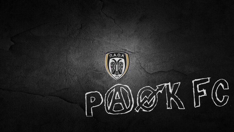 PAOK FC logo on dark wall
