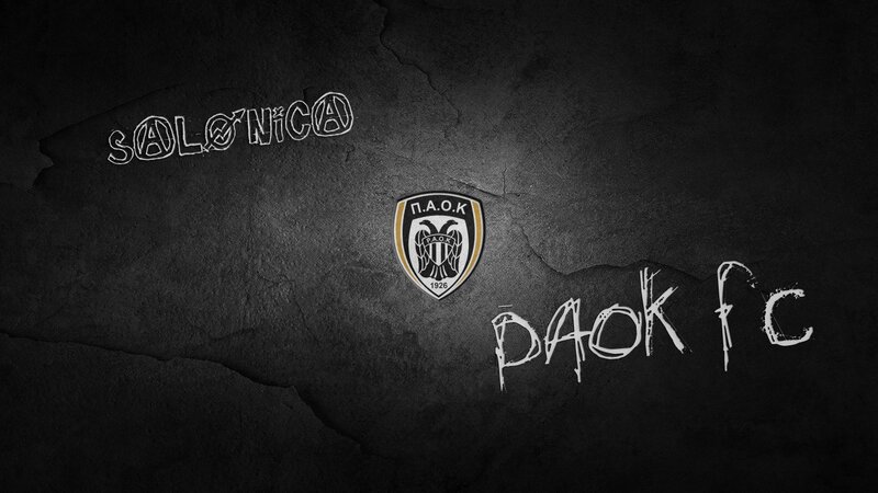 PAOK FC logo on dark wall