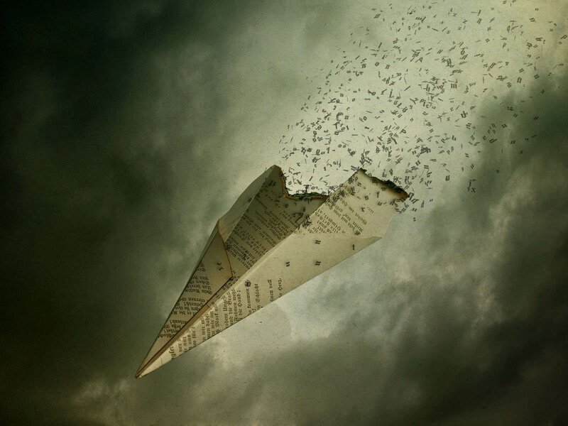 Paper airplane disintegrating in storm