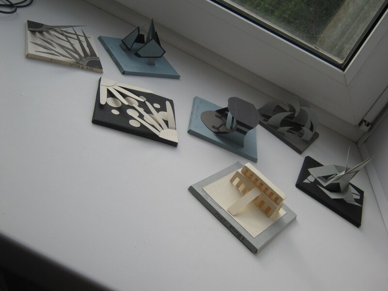 Paper art models on a windowsill