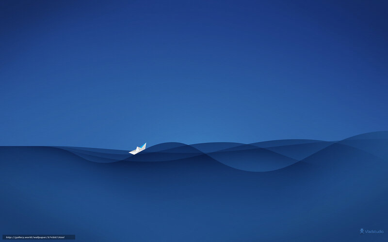 Paper boat on blue waves