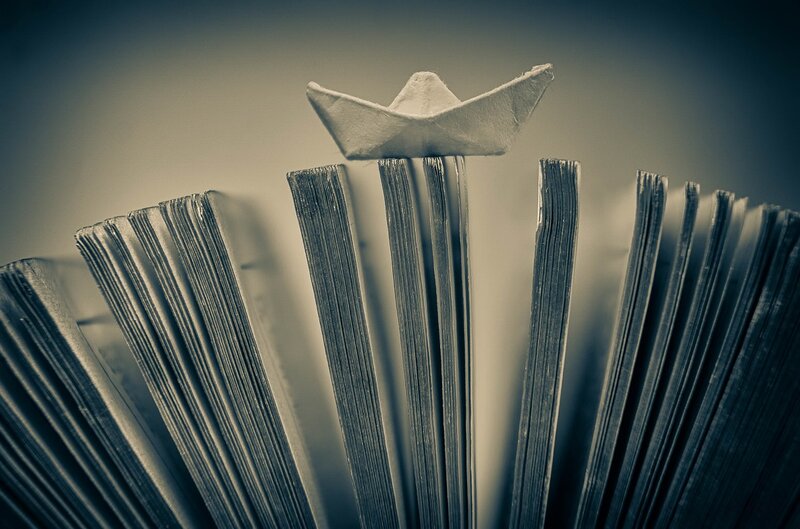 Paper Boat on Book Pages