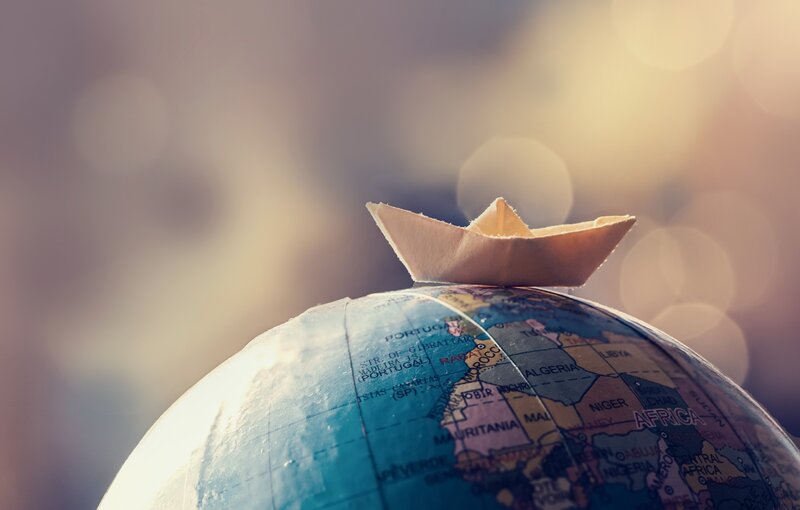 Paper Boat on Globe