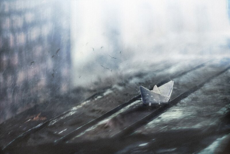 Paper Boat on Wet Surface