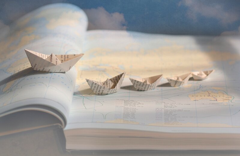 Paper Boats on Map — Blue