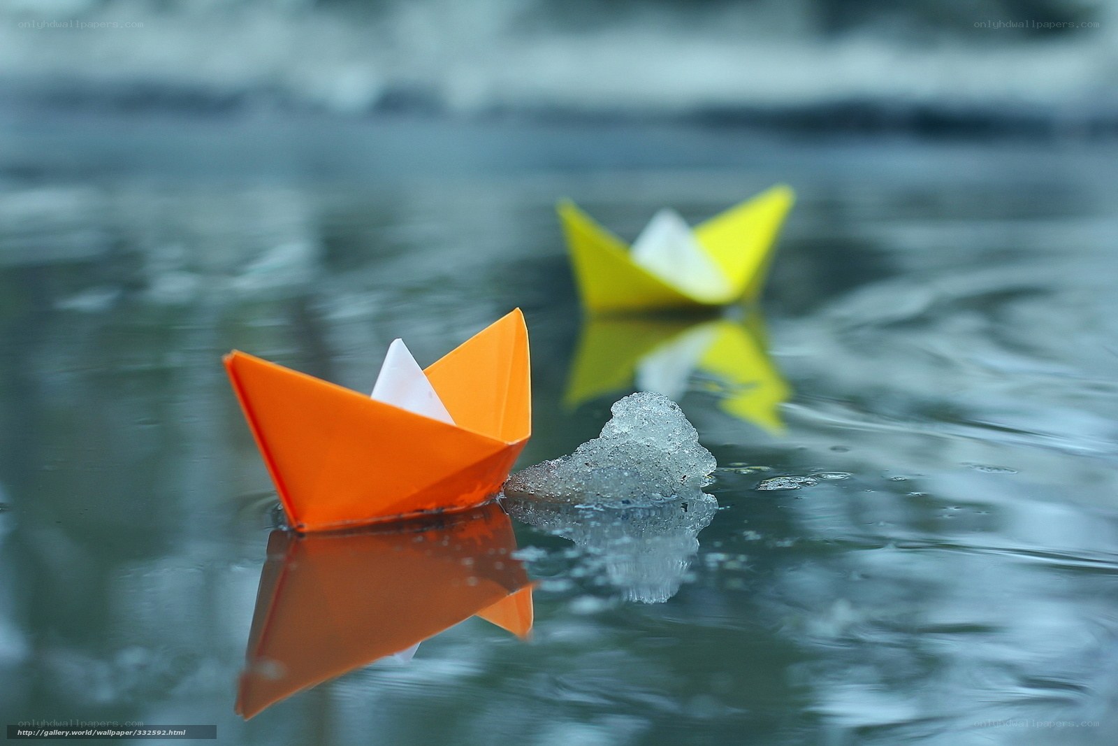 Paper boats on water