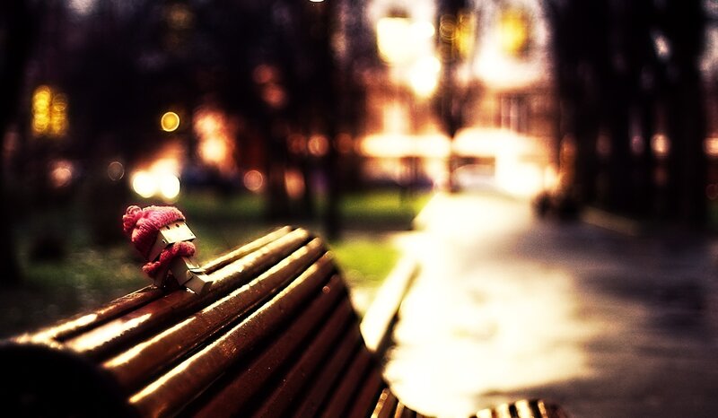 Paper Figure on Bench — Brown, Dramatic
