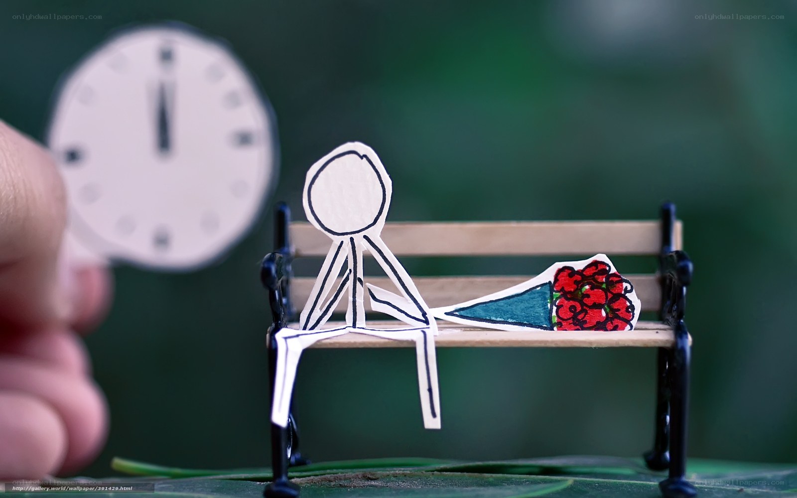 Paper figure on bench