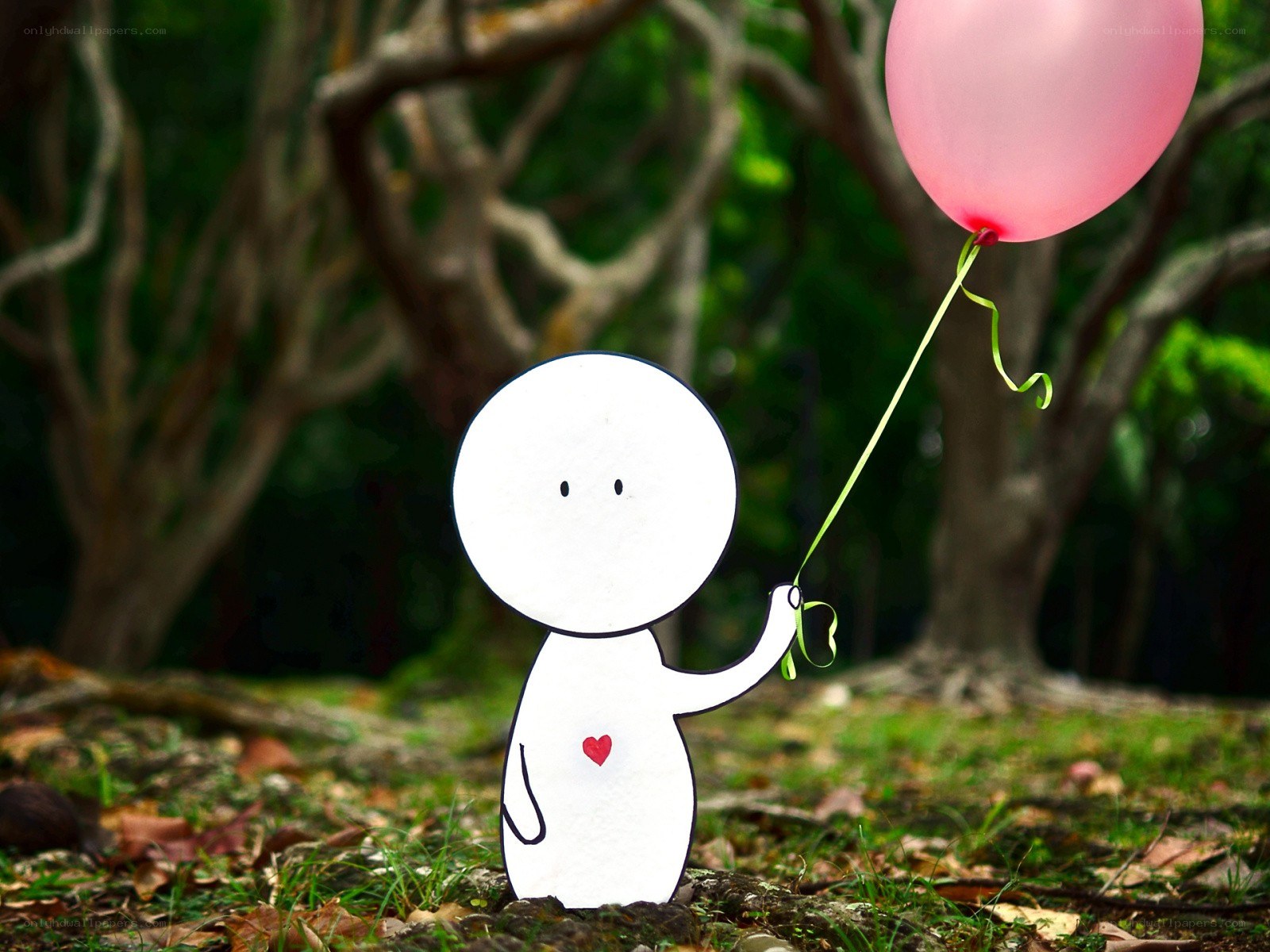 Paper figure with pink balloon