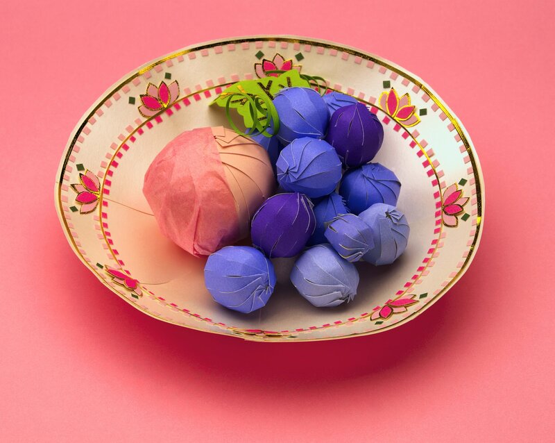 Paper fruit in a decorative bowl