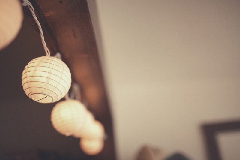 Paper lanterns hanging from a beam