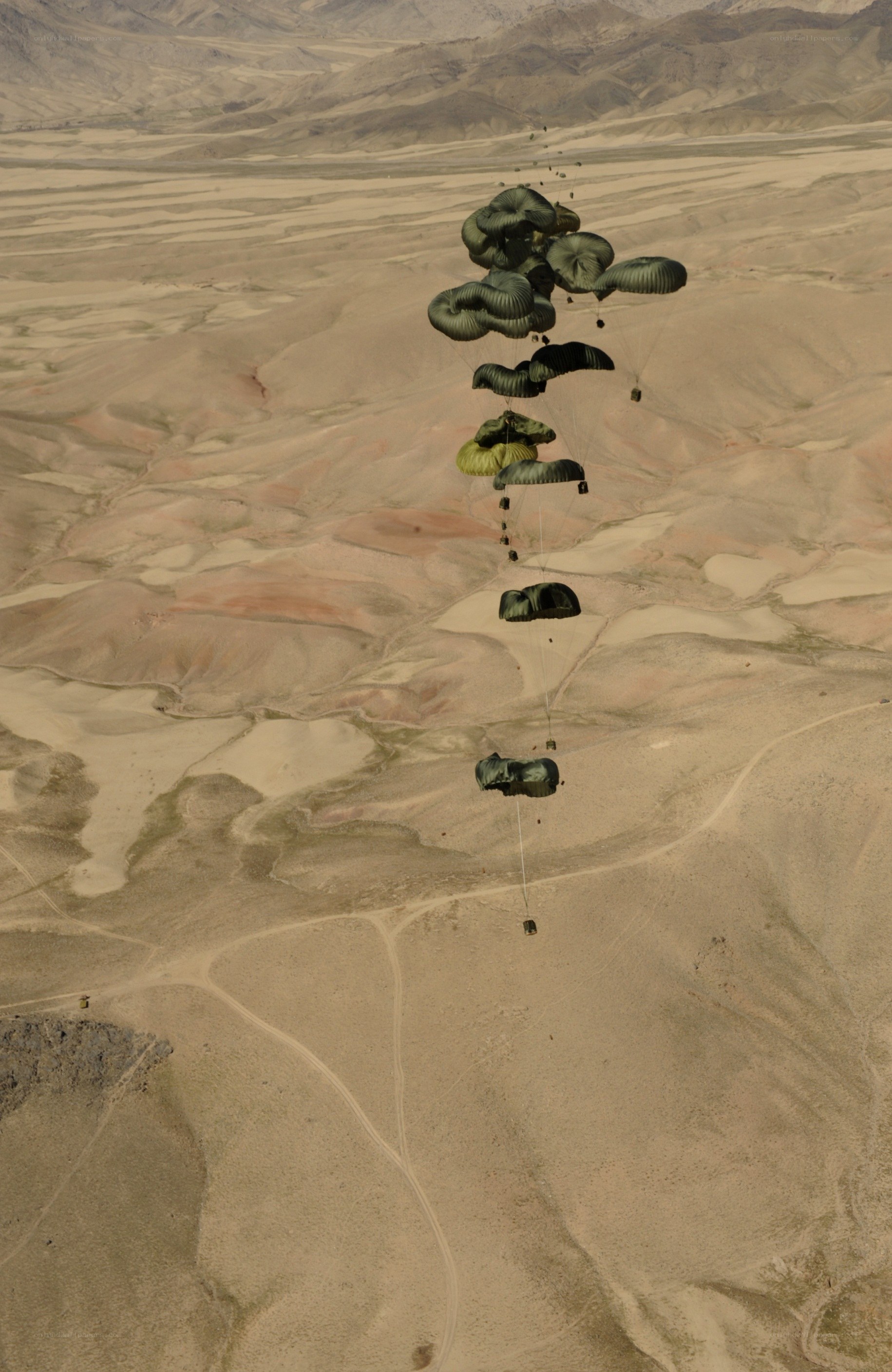 Parachute drop over desert