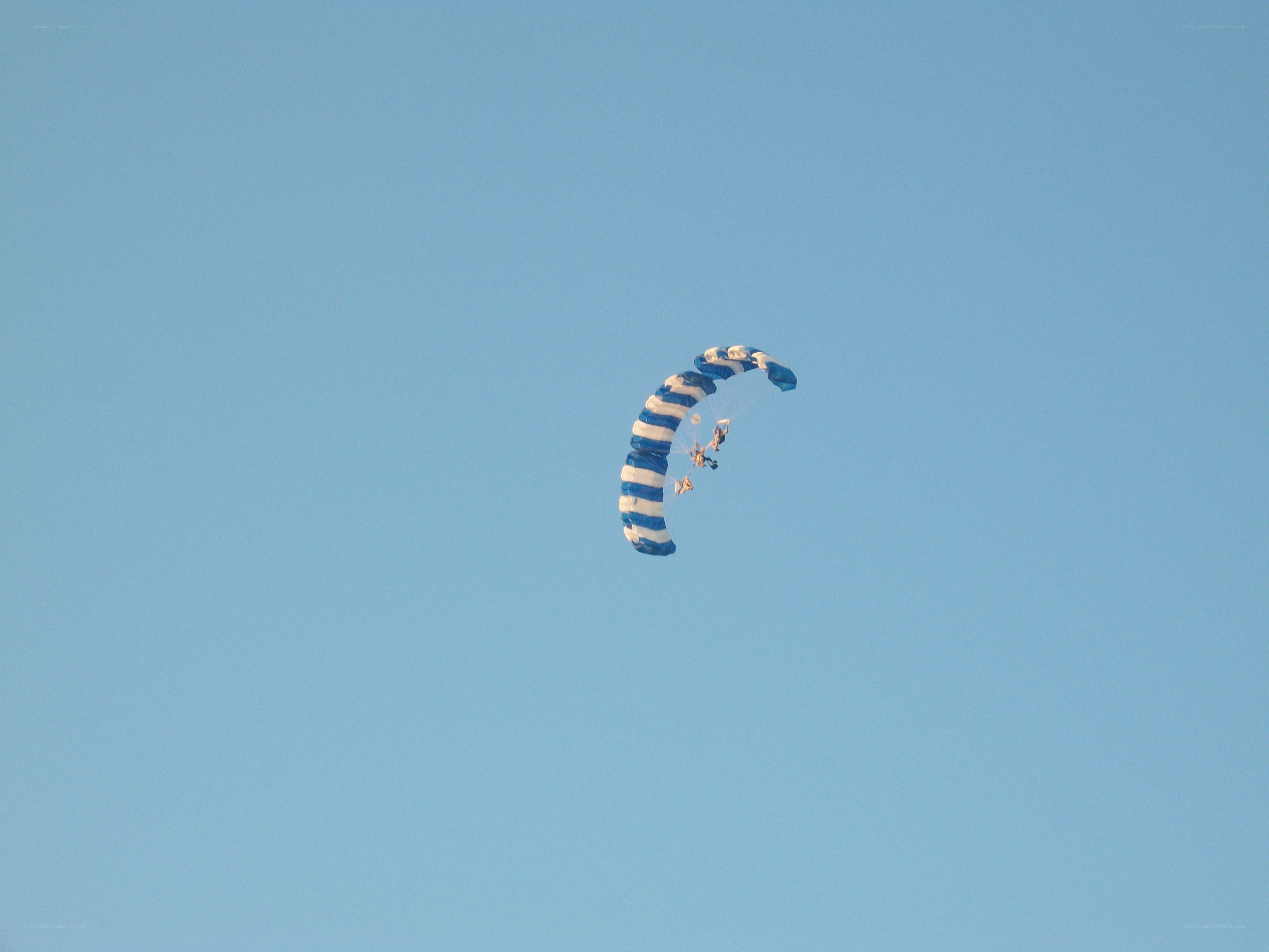 Parachute in blue sky