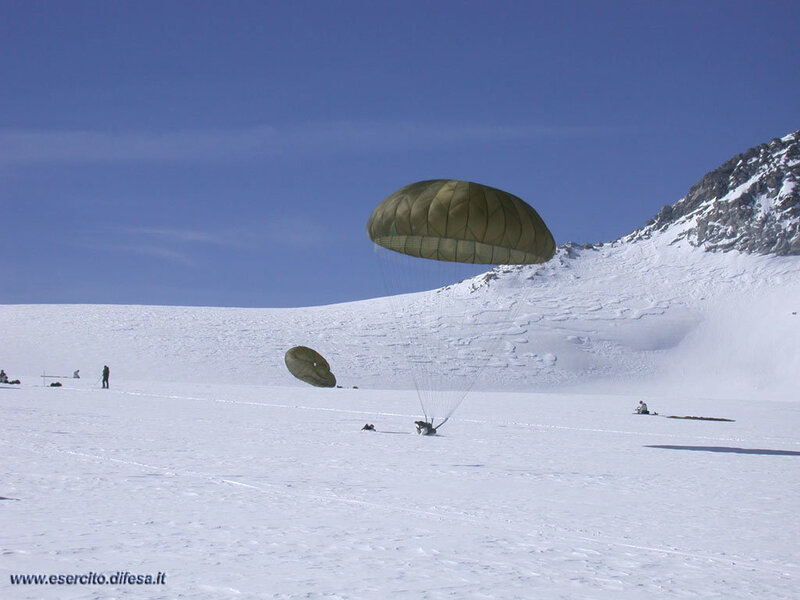Parachute landing in snowy mountains