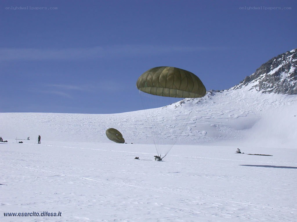 Parachute landing in snowy mountains