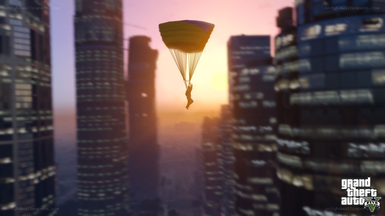 parachuting over city at sunset