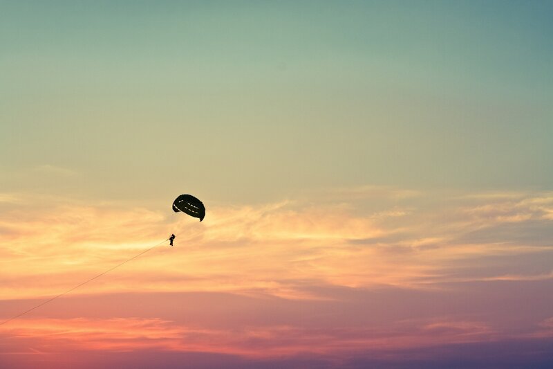 Parachutist at sunset
