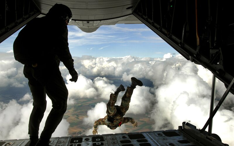 Parachutist Jumping from Plane — White, Dramatic