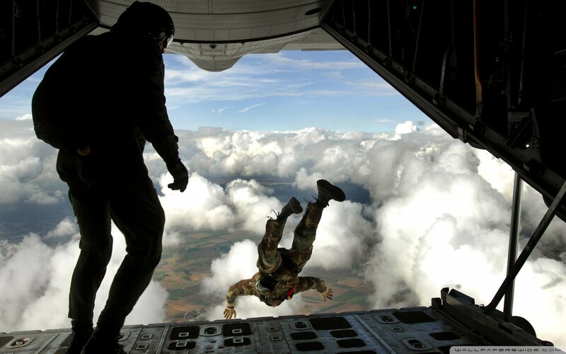 Parachutist Jumping from Plane — White