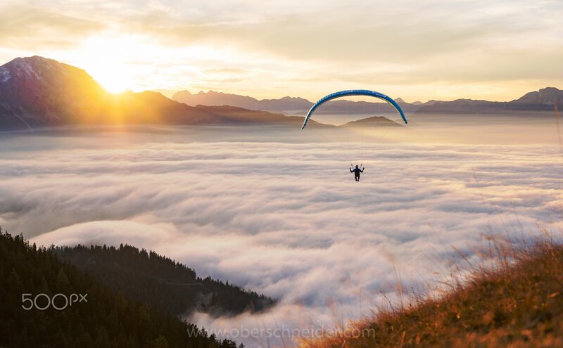 Paraglider Above Clouds — Blue, Serene, Sunrise