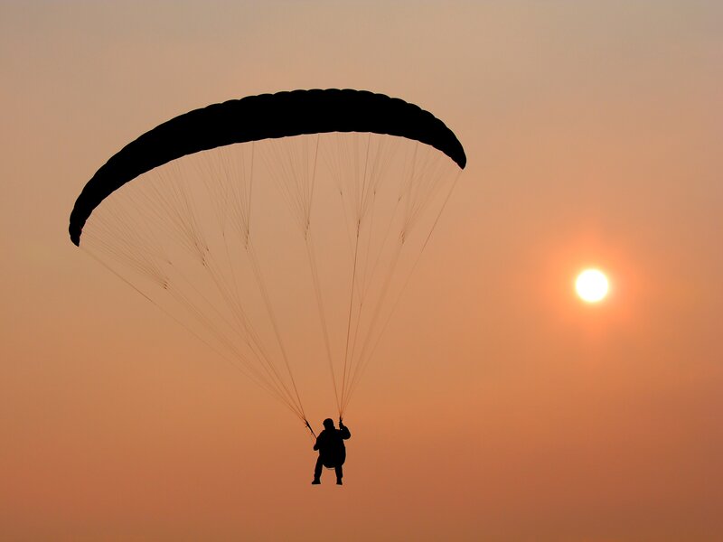 Paraglider at sunset
