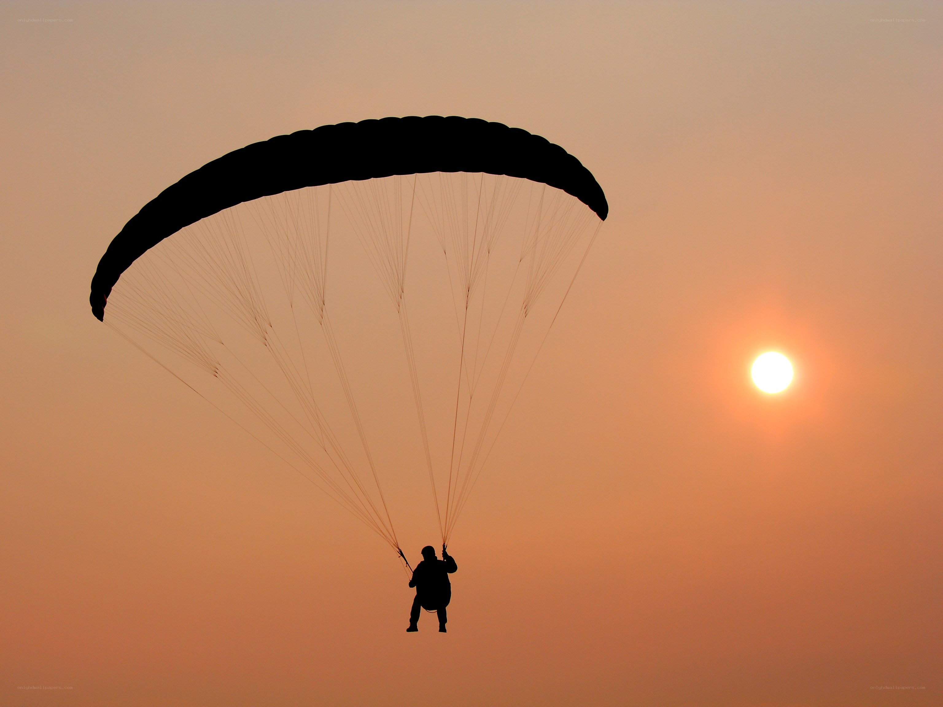 Paraglider at sunset