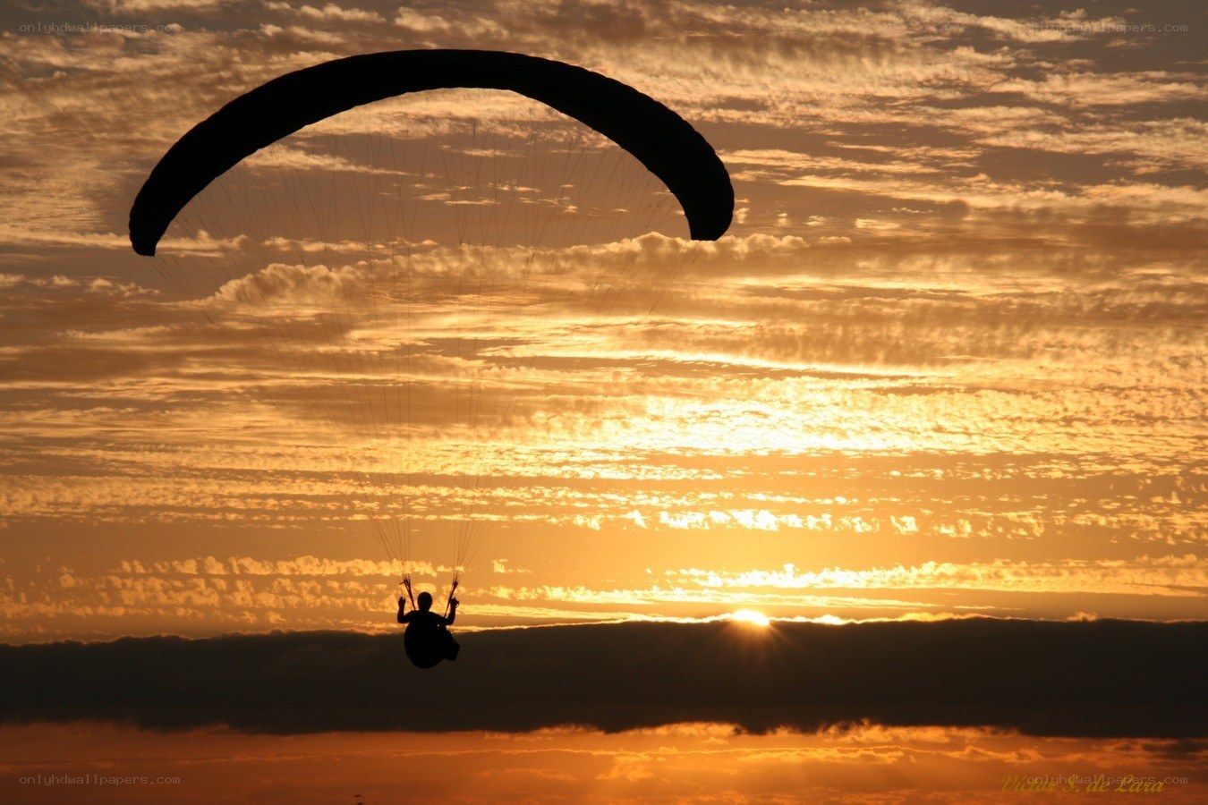 Paraglider at sunset