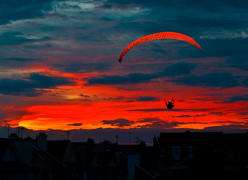 Paraglider at sunset