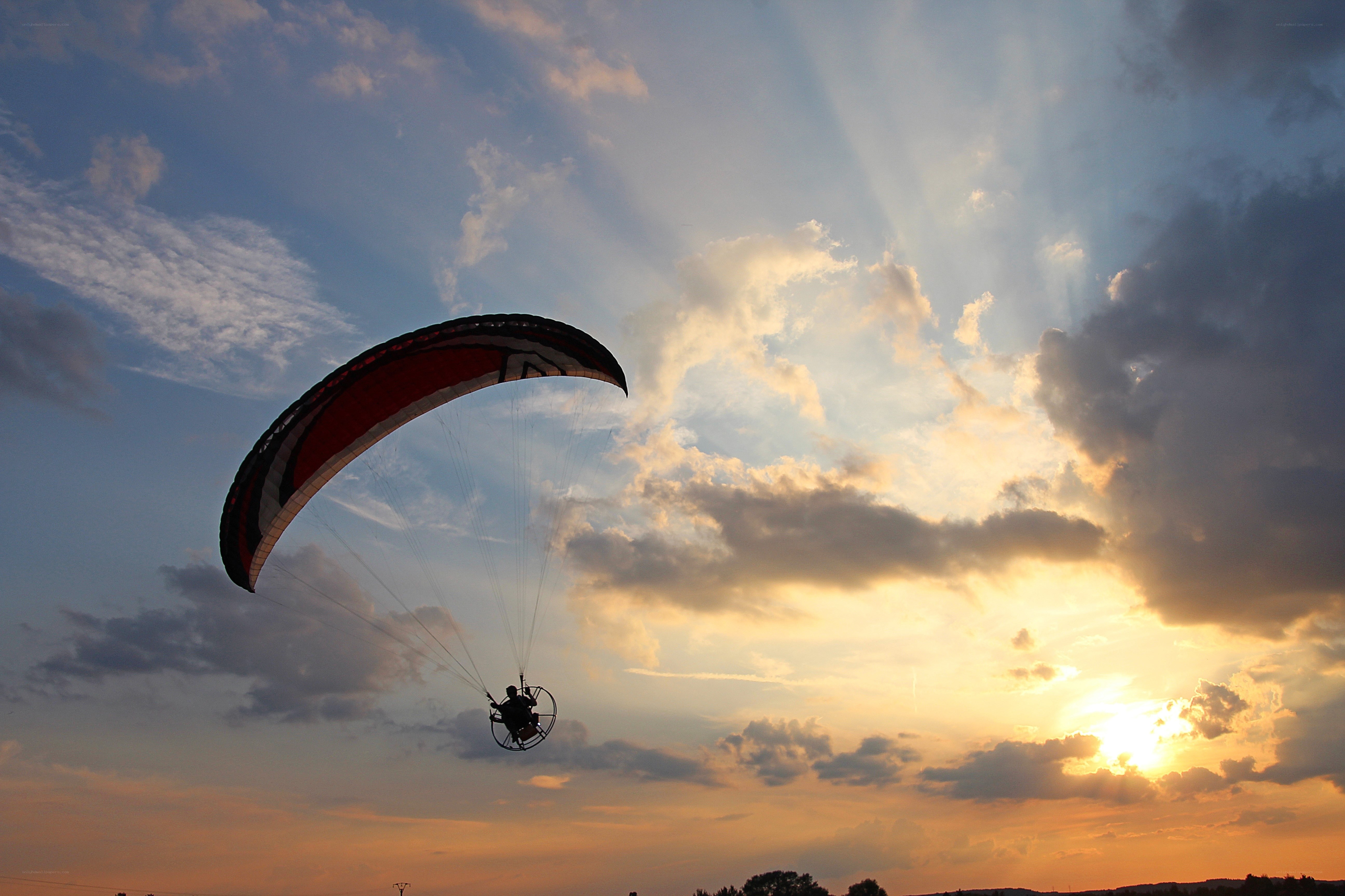 Paraglider at sunset