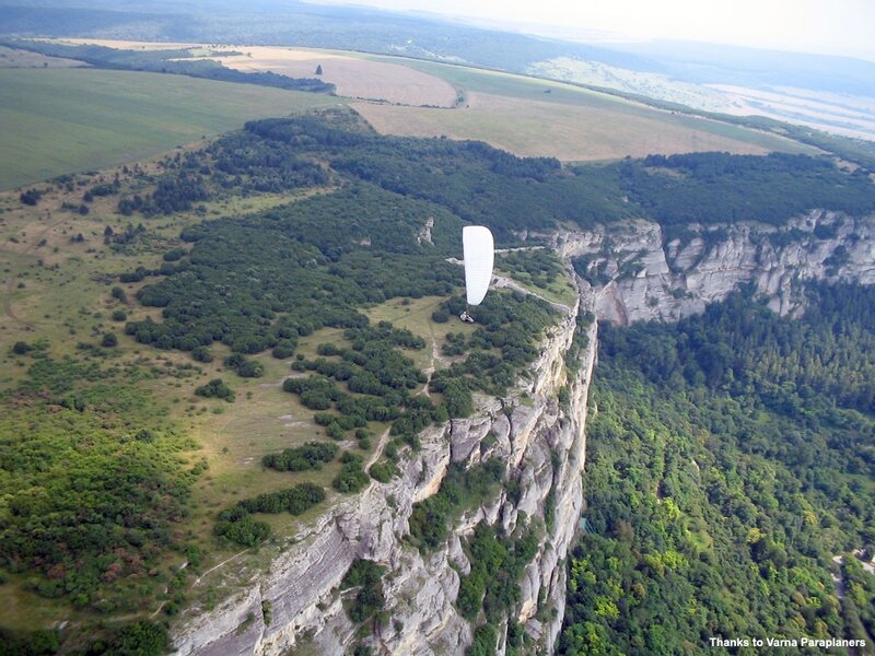 Paraglider over a cliff