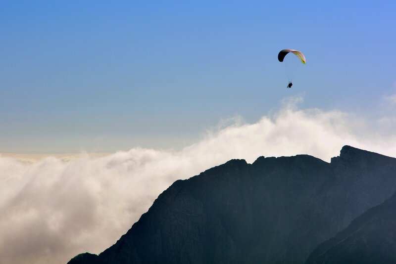 Paraglider over Mountain — Blue