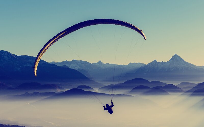 Paraglider over Mountains — Blue, Serene, Morning