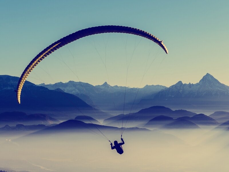 Paraglider over Mountains — Blue