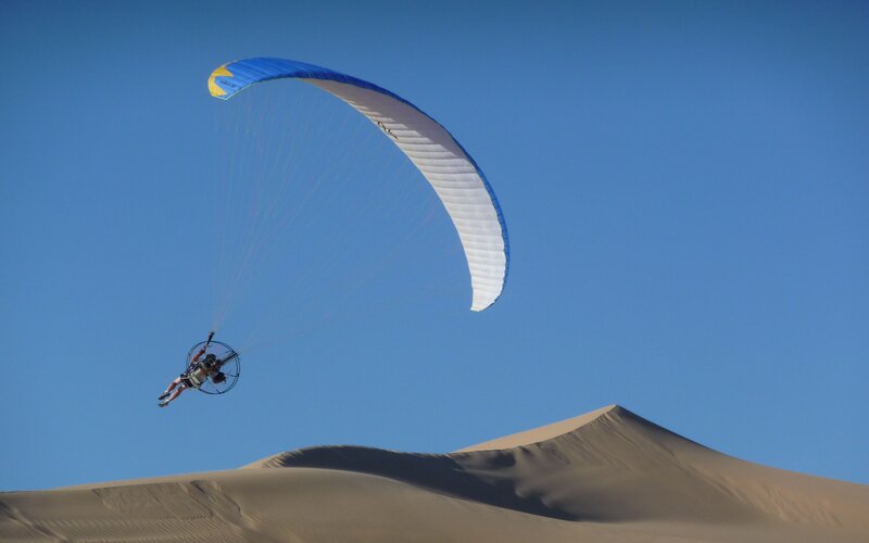 Paraglider over Sand Dunes — Blue