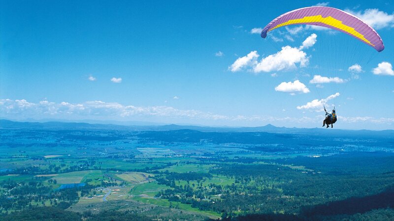 Paraglider over Valley — Blue