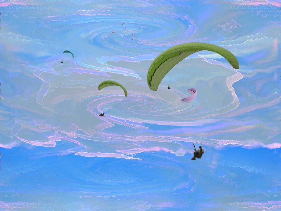 Paragliders in a swirling sky