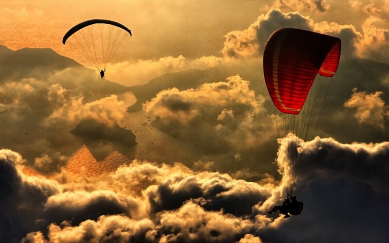 Paragliders in Clouds