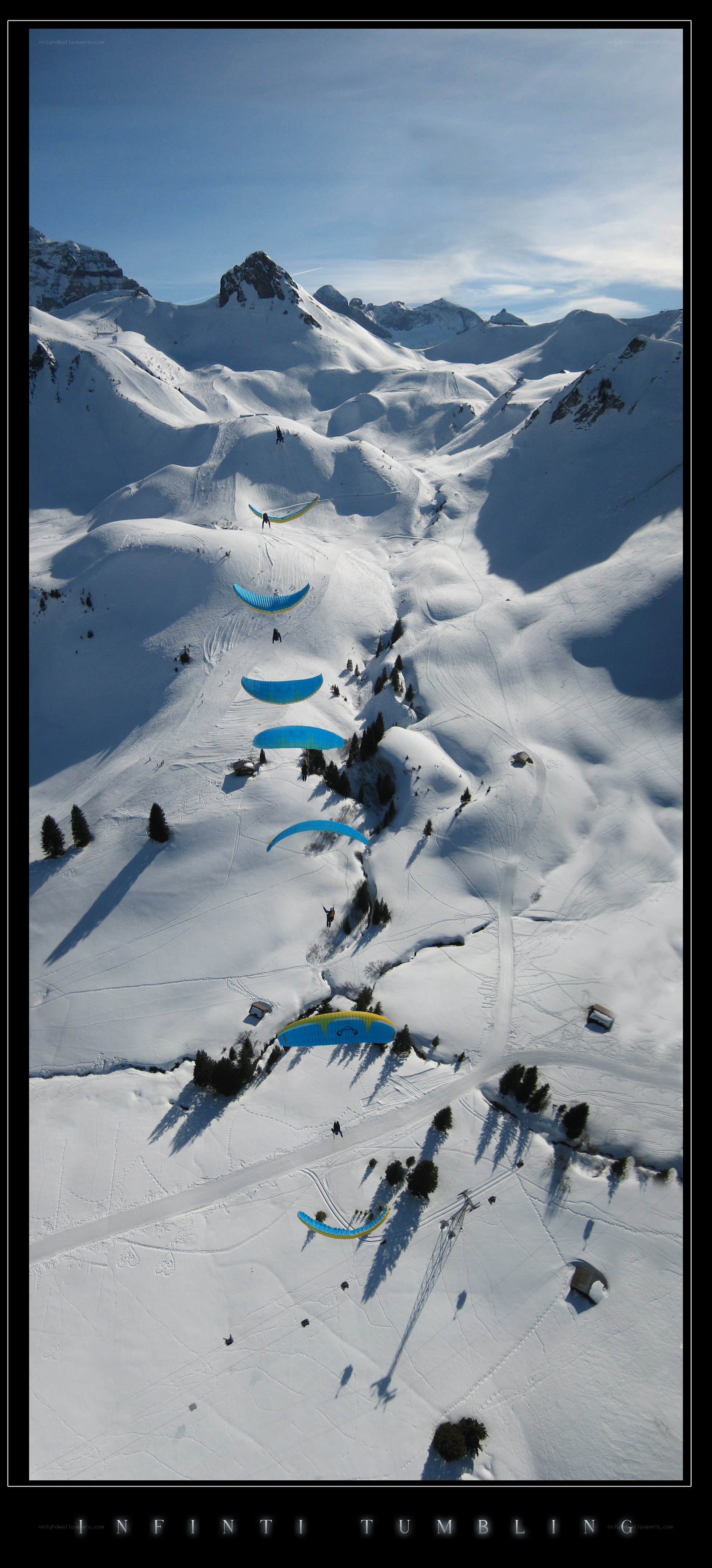 Paragliders in snowy mountains