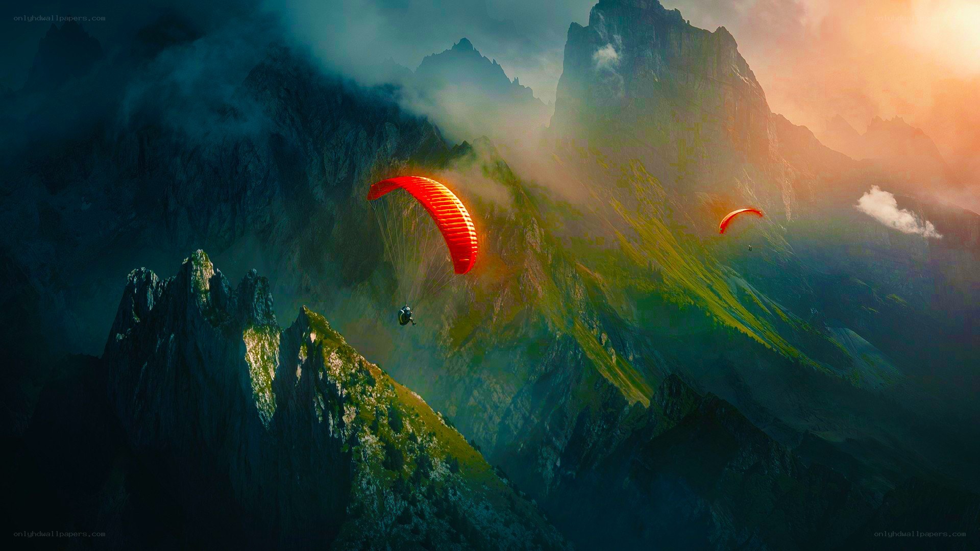 Paragliders over mountain peaks
