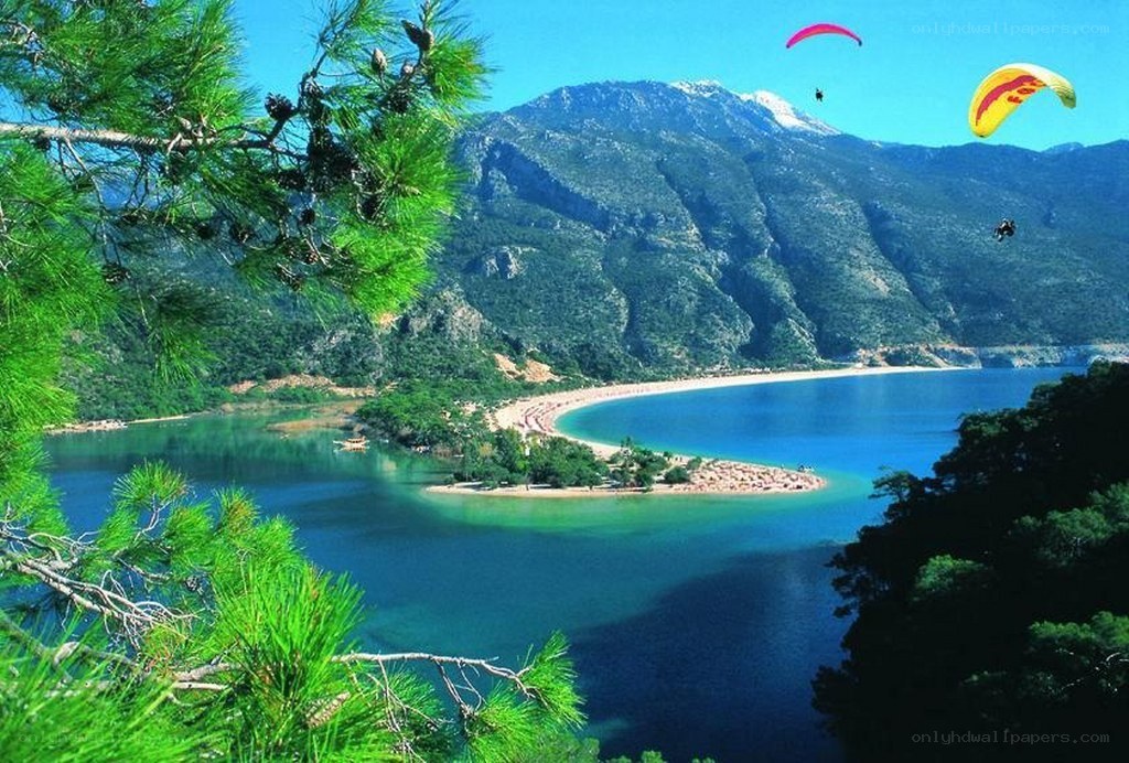 Paragliding over a coastal bay