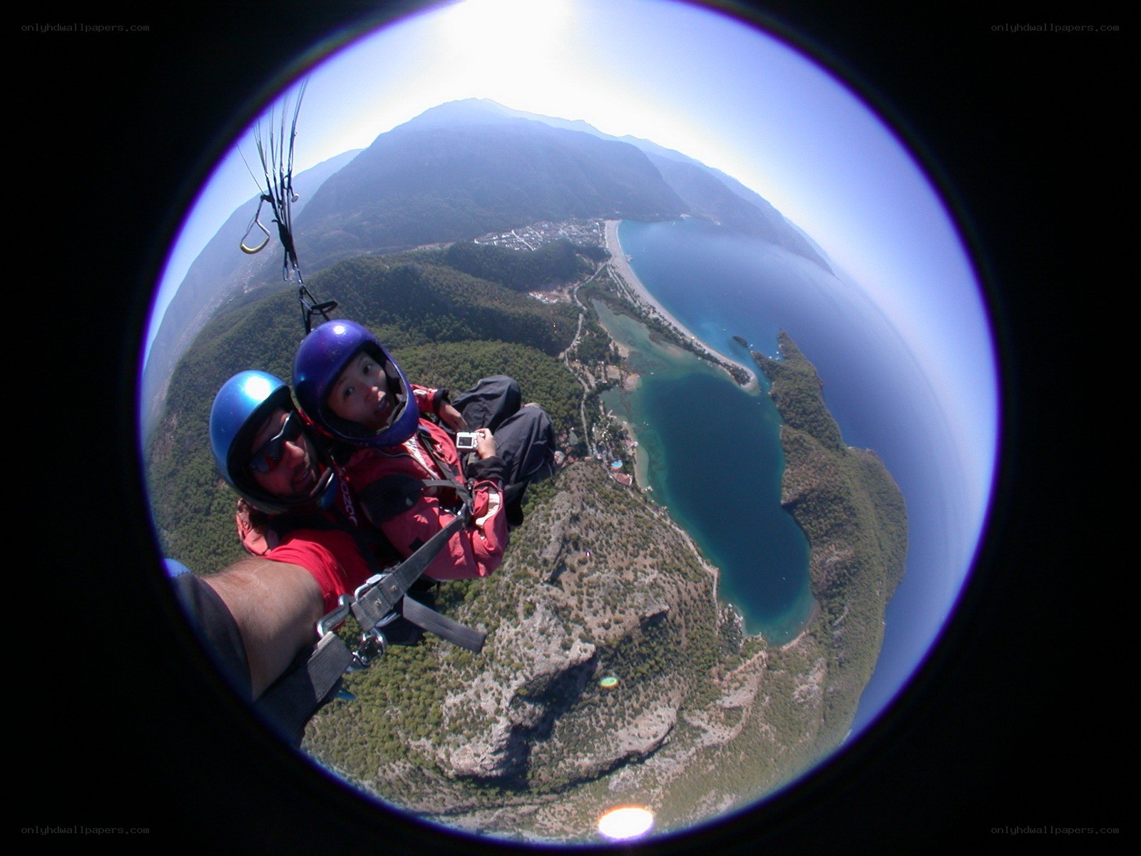 Paragliding over a coastal landscape