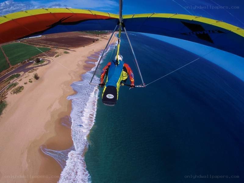 Paragliding over beach and ocean
