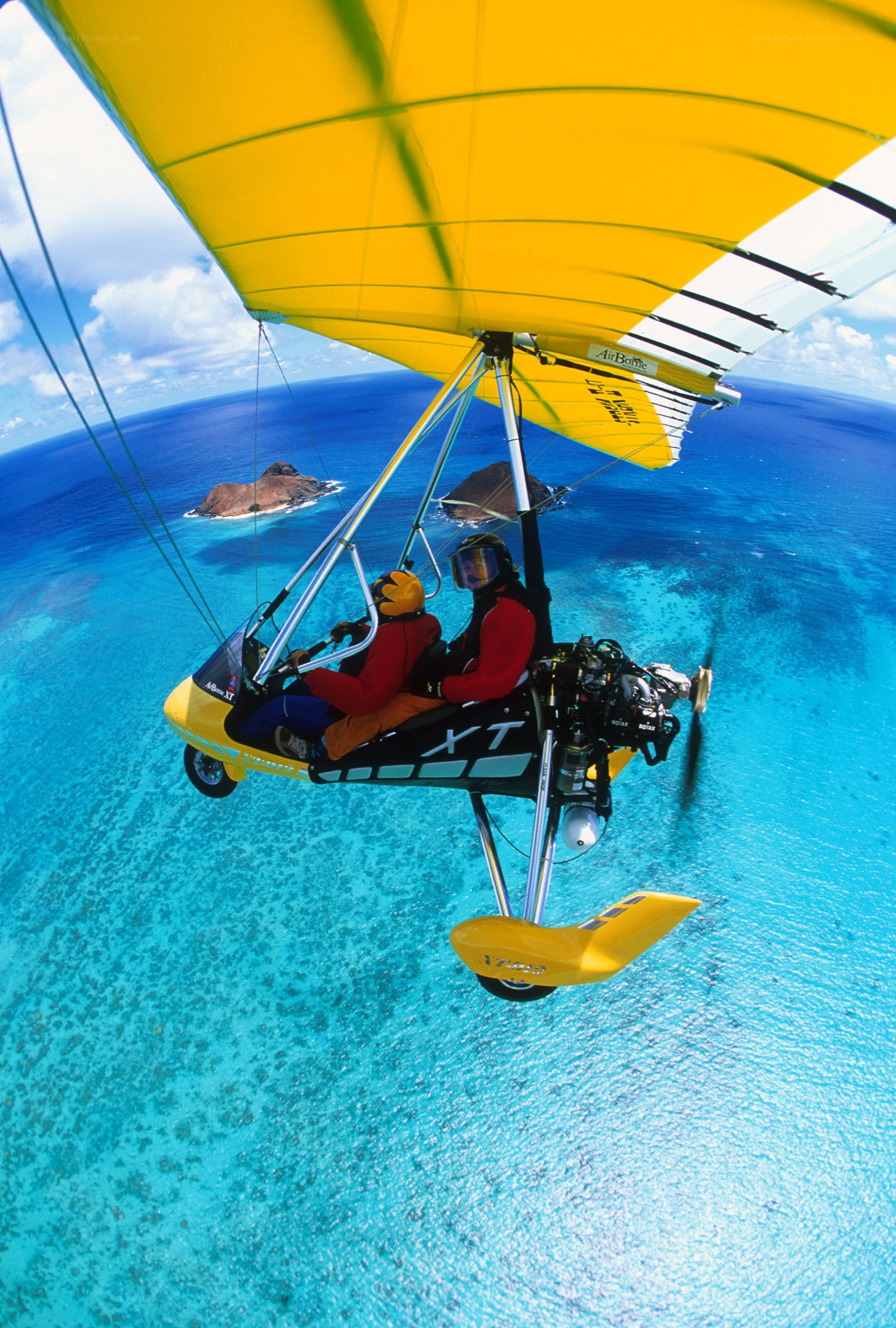 Paragliding over tropical ocean