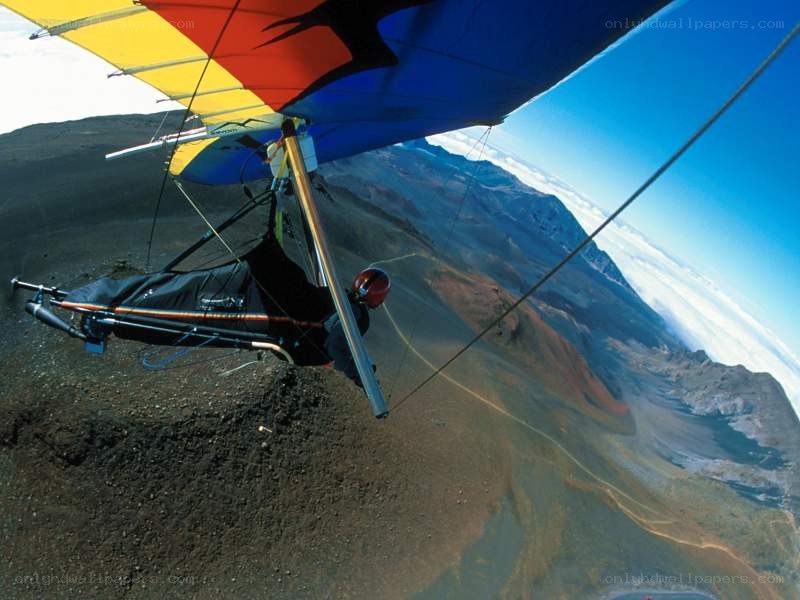Paragliding over volcanic landscape