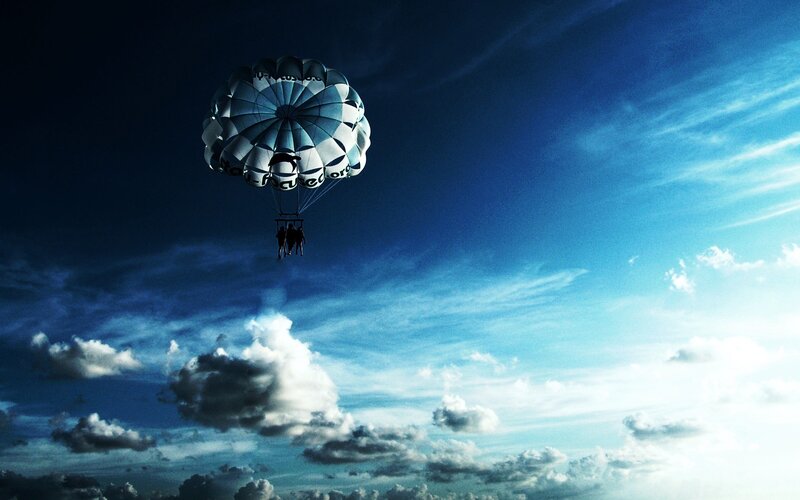 Parasailing over Clouds — Blue, Dramatic
