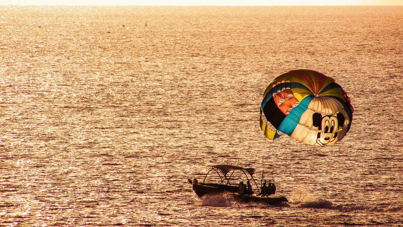 Parasailing over Ocean — Gold