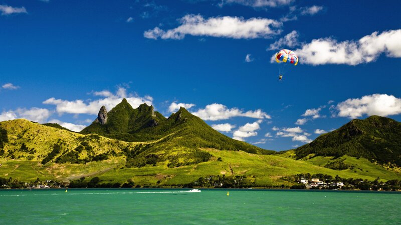 Parasailing over Tropical Island — Blue