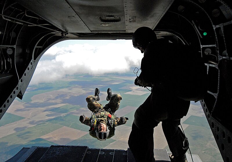 Paratrooper jumping from aircraft