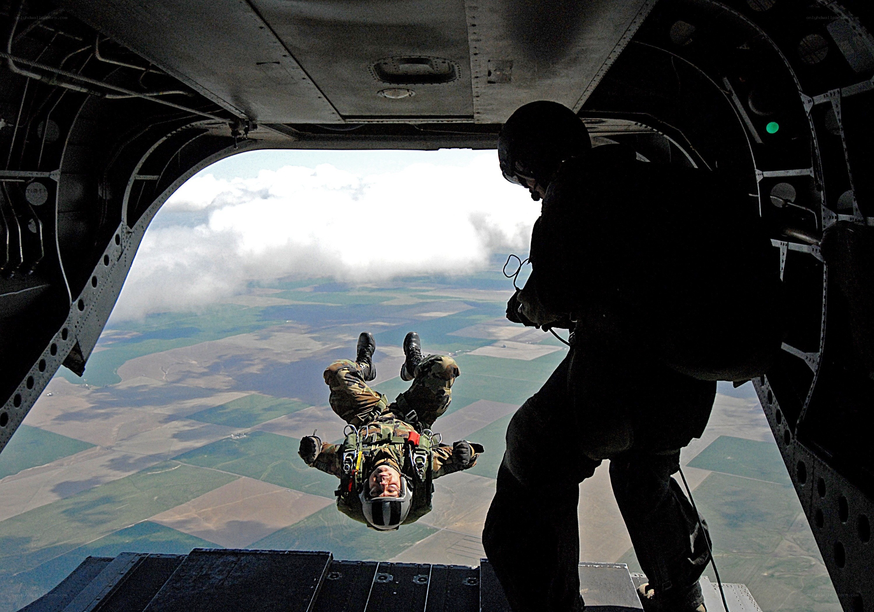Paratrooper jumping from aircraft