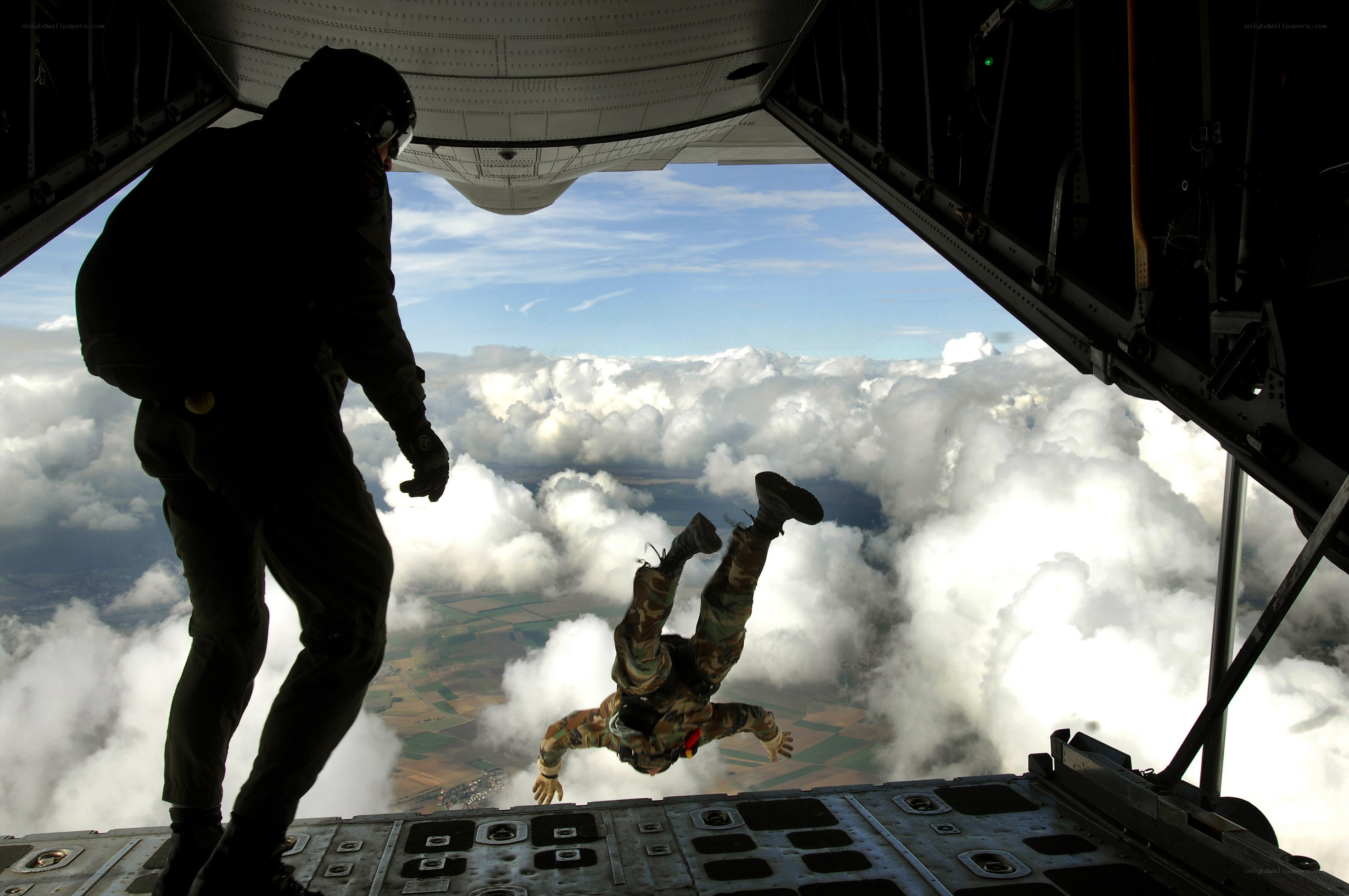 Paratrooper jumping from aircraft